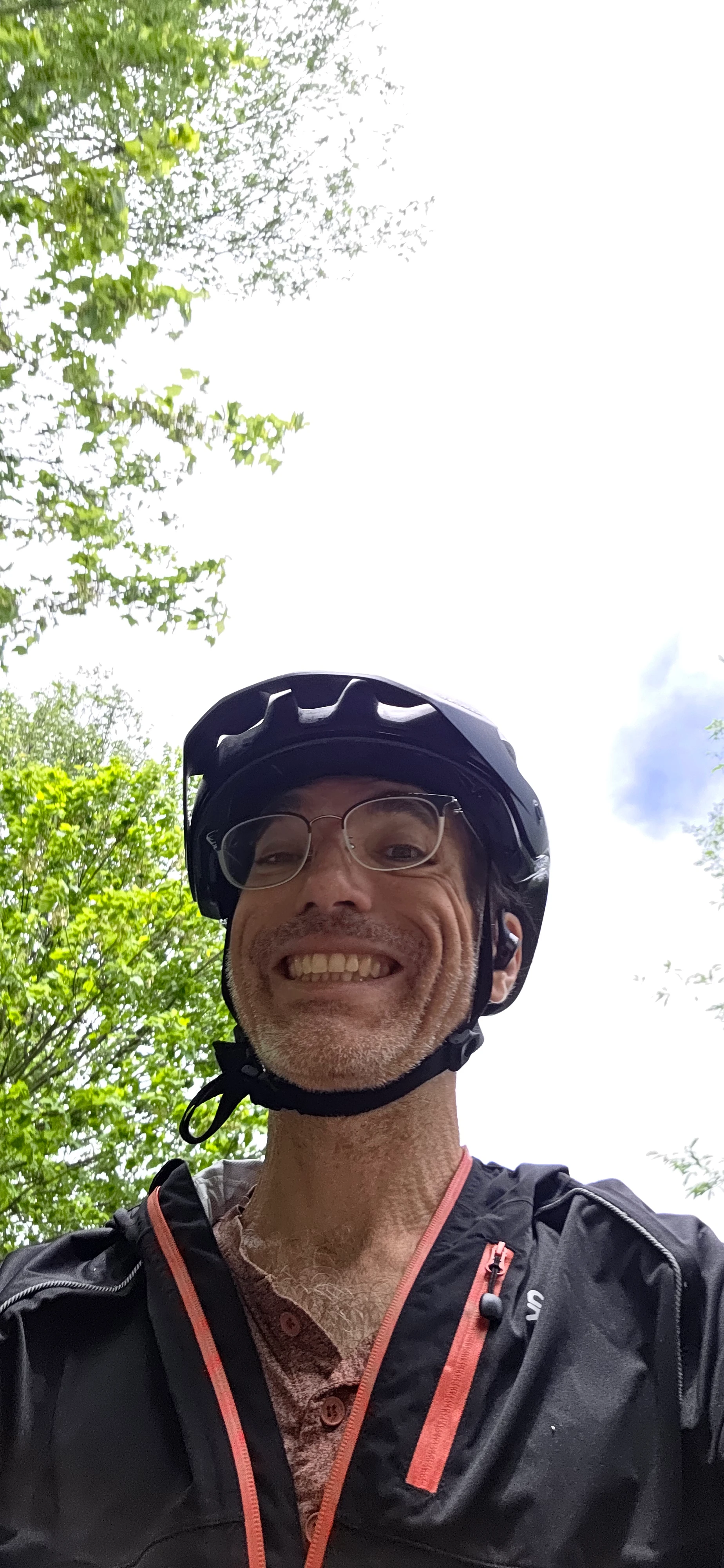 Richard Massel wearing a black cycling helmet outdoors.